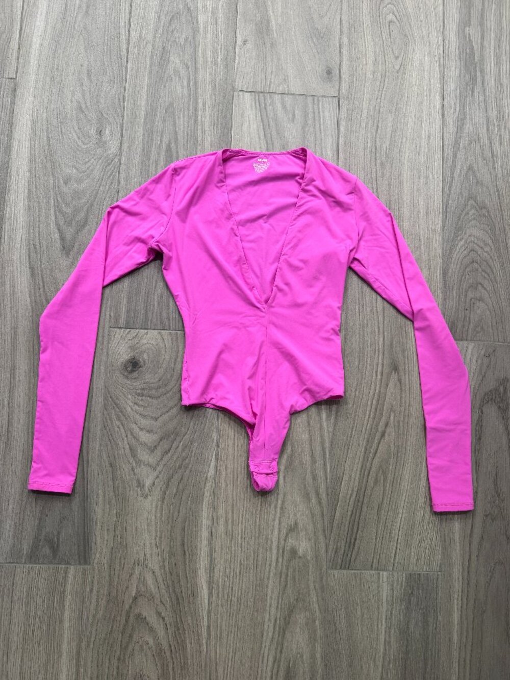 SKIMS Fits Everybody Plunge Long Sleeve Bodysuit in Pink